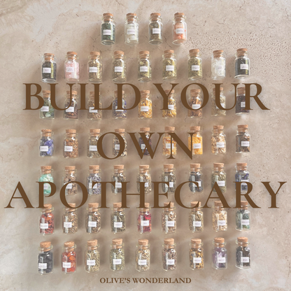 Stone with small glass jars labeled 'Build Your Own Apothecary' by Olive's Wonderland.